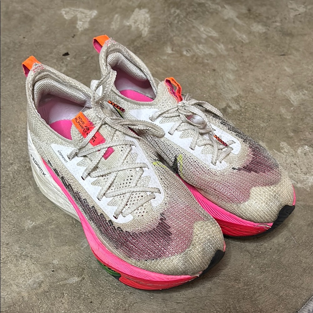 Nike Pink and White Athletic Shoes with Supportive Midsole